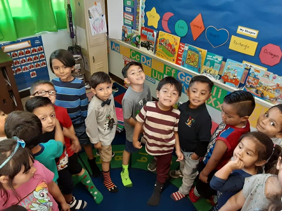 Teacher engaging with Kids 1st preschoolers in Los Angeles County in our early childhood curriculum programs